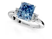 3 Stone Engagement Ring Setting for Fancy Blue Radiant Cut Center with Wide Plain Band and Prong Head in Platinum