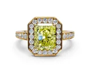 Bezel-Framed Halo Engagement Ring Setting for Fancy Yellow Radiant Cut Center with Pave Band and Prong Head in Yellow Gold