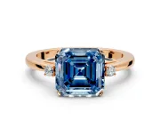 3 Stone Engagement Ring Setting for Fancy Blue Asscher Cut Center with Low-Set Round Cut Accents and Prong Head in Rose Gold