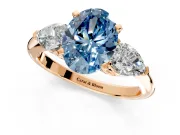 3 Stone Engagement Ring Setting for Fancy Blue Oval Center with Large Pear-Shaped Accents and Prong Head in Rose Gold