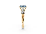 5 Stone Engagement Ring Setting for Fancy Blue Radiant Cut Center with Graduated Accents and Prong Head in Yellow Gold