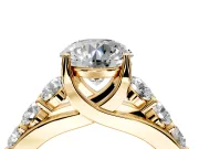 Solitaire Engagement Ring Setting for Round Cut Center with Graduated Shared Prongs and Prong Head in Yellow Gold