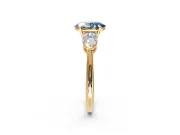 3 Stone Engagement Ring Setting for Fancy Blue Oval Center with Large Pear-Shaped Accents and Prong Head in Yellow Gold