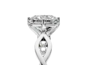 Solitaire Engagement Ring Setting for Radiant Cut Center with Accented Twist Band and Leaf Prong Head in Platinum