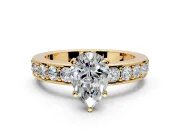Solitaire Engagement Ring Setting for Pear-Shaped Center with Channel-Set Accents and Prong Head in Yellow Gold