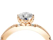 Solitaire Engagement Ring Setting for Pear-Shaped Center with Milgrain-Edged Pave Band and Prong Head in Rose Gold