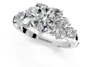 Cluster Engagement Ring Setting for Heart-Shaped Center with Round Cut Accent Frame and Prong Head in Platinum