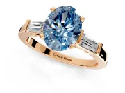 3 Stone Engagement Ring Setting for Fancy Blue Oval Center with Channel Baguette Accents and Prong Head in Rose Gold