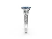 Channel-Set Engagement Ring Setting for Fancy Blue Pear-Shaped Center with Baguette Band and Prong Head in Sterling Silver