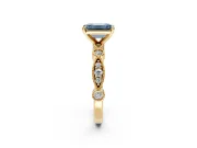 Solitaire Engagement Ring Setting for Fancy Blue Emerald Cut Center with Milgrain Bezel Accents and Prong Head in Yellow Gold