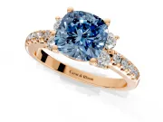 Paired Accent Engagement Ring Setting for Fancy Blue Cushion Cut Center with Pave Band and Prong Head in Rose Gold