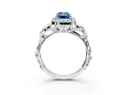 Halo Engagement Ring Setting for Fancy Blue Emerald Cut Center with Open Scroll Shoulders and Prong Head in Platinum