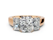 3 Stone Engagement Ring Setting for Radiant Cut Center with Raised Basket Heads and Prong Head in Rose Gold