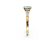 3 Stone Engagement Ring Setting for Fancy Blue Princess Cut Center with Channel Baguette Accents and Prong Head in Yellow Gold
