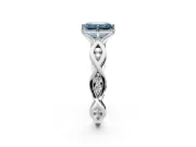 Solitaire Engagement Ring Setting for Fancy Blue Emerald Cut Center with Accented Twist Band and Leaf Prong Head in Platinum