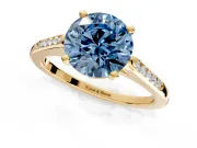 Solitaire Engagement Ring Setting for Fancy Blue Round Cut Center with Channel Accents and Prong Head in Yellow Gold