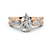 3 Stone Engagement Ring Setting for Pear-Shaped Center with Pave Split Shank and Prong Head in Rose Gold