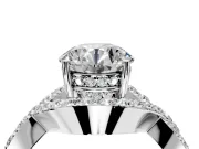 Halo Engagement Ring Setting for Round Cut Center with Pave Infinity Twist Band and Prong Head in Platinum