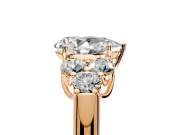 Cluster Engagement Ring Setting for Pear-Shaped Center with Round Cut Accent Frame and Prong Head in Rose Gold