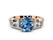 Channel-Set Engagement Ring Setting for Fancy Blue Round Cut Center with Baguette Band and Prong Head in Rose Gold