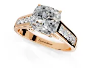 Solitaire Engagement Ring Setting for Cushion Cut Center with Round Cut Channel Band and Prong Head in Rose Gold