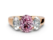 3 Stone Engagement Ring Setting for Fancy Pink Oval Center with Raised Basket Heads and Prong Head in Rose Gold