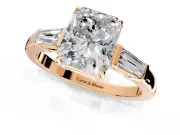 3 Stone Engagement Ring Setting for Radiant Cut Center with Baguette Accents and Prong Head in Rose Gold