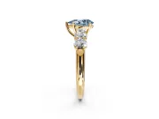 5 Stone Engagement Ring Setting for Fancy Blue Pear-Shaped Center with Graduated Accents and Prong Head in Yellow Gold