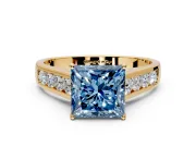 Solitaire Engagement Ring Setting for Fancy Blue Princess Cut Center with Cathedral Channel Band and Prong Head in Yellow Gold