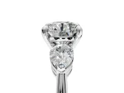 3 Stone Engagement Ring Setting for Round Cut Center with Large Pear-Shaped Accents and Prong Head in Platinum