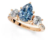 3 Stone Engagement Ring Setting for Fancy Blue Pear-Shaped Center with Crossover Basket, Pave Band and Prong Head in Rose Gold