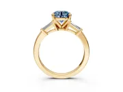 3 Stone Engagement Ring Setting for Fancy Blue Round Cut Center with Channel Baguette Accents and Prong Head in Yellow Gold