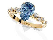 Cluster Engagement Ring Setting for Fancy Blue Pear-Shaped Center with Round Cut Accent Band and Prong Head in Yellow Gold