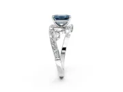 Solitaire Engagement Ring Setting for Fancy Blue Emerald Cut Center with Pave Bypass Twist Band and Prong Head in Sterling Silver