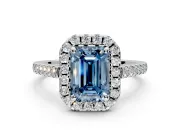 Halo Engagement Ring Setting for Fancy Blue Emerald Cut Center with Raised Halo, Pave Band and Prong Head in Sterling Silver