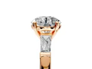 3 Stone Engagement Ring Setting for Round Cut Center with Tapered Baguettes, Plain Band and Prong Head in Rose Gold
