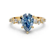 Solitaire Engagement Ring Setting for Fancy Blue Pear-Shaped Center with Trailing Leaf Accent Band and Prong Head in Yellow Gold