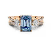 3 Stone Engagement Ring Setting for Fancy Blue Emerald Cut Center with Pave Split Shank and Prong Head in Rose Gold