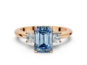 3 Stone Engagement Ring Setting for Fancy Blue Emerald Cut Center with Wide Plain Band and Prong Head in Rose Gold