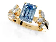 Floral Engagement Ring Setting for Fancy Blue Emerald Cut Center with Trailing Marquise Accents and Prong Head in Yellow Gold