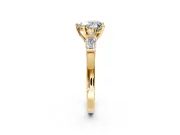 3 Stone Engagement Ring Setting for Heart-Shaped Center with Channel Baguette Accents and Prong Head in Yellow Gold