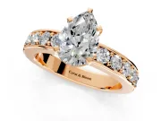 Solitaire Engagement Ring Setting for Pear-Shaped Center with Channel-Set Accents and Prong Head in Rose Gold