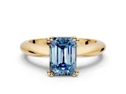 Solitaire Engagement Ring Setting for Fancy Blue Emerald Cut Center with Reverse Tapered Band and Prong Head in Yellow Gold
