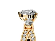 3 Stone Engagement Ring Setting for Heart-Shaped Center with Pave Twist Band and Prong Head in Yellow Gold