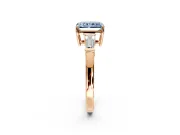 3 Stone Engagement Ring Setting for Fancy Blue Radiant Cut Center with Baguette Accents and Prong Head in Rose Gold