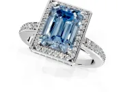 Halo Engagement Ring Setting for Fancy Blue Emerald Cut Center with Metal-Rimmed Halo, Pave Band and Prong Head in Platinum