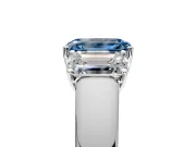 3 Stone Engagement Ring Setting for Fancy Blue Emerald Cut Center with Raised Basket Heads and Prong Head in Platinum