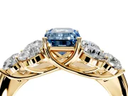 Cluster Engagement Ring Setting for Fancy Blue Emerald Cut Center with Round Cut Accent Frame and Prong Head in Yellow Gold