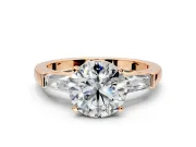 3 Stone Engagement Ring Setting for Round Cut Center with Tapered Baguettes, Plain Band and Prong Head in Rose Gold