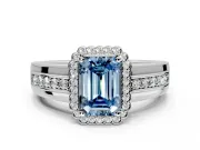 Halo Engagement Ring Setting for Fancy Blue Emerald Cut Center with Wide Band, Inlaid Accent Row and Prong Head in Platinum